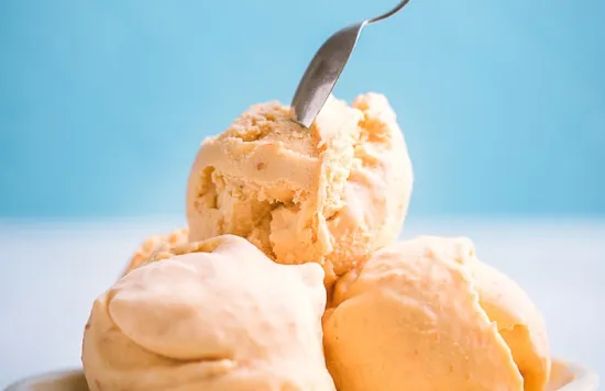Bowl of ice cream with a spoon on top