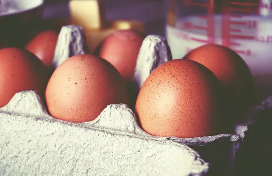 Brown eggs in cardboard carton