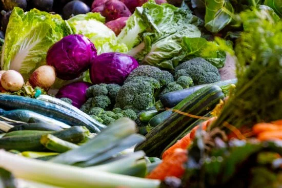 Assorted fresh vegetables including broccoli and cabbage