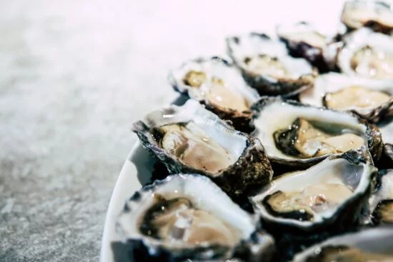 Fresh oysters on plate