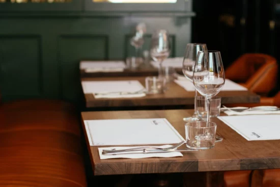 Set restaurant table with glasses and menu
