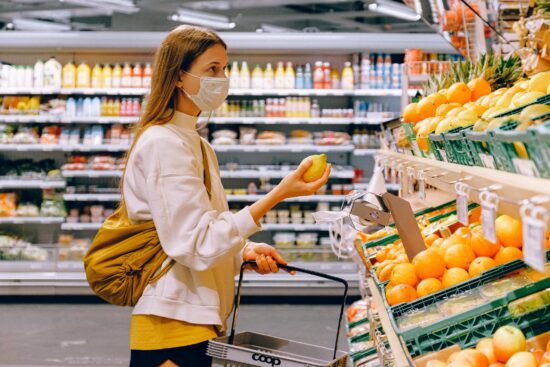 picking lemons at grocery store