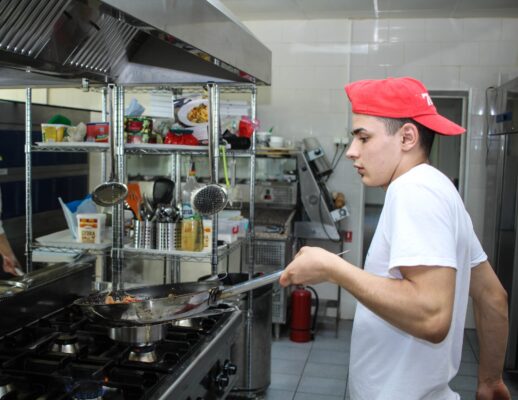 chef sautéing in kitchen