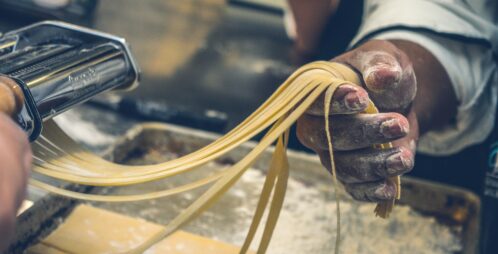 Homemade pasta being cut