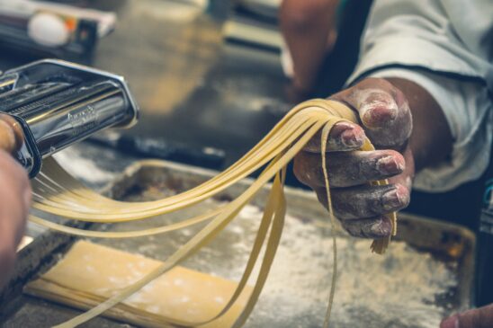 Homemade pasta being cut